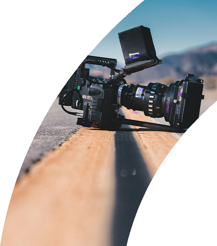 Cinema camera rig on location, branded in the Screen and Music purple